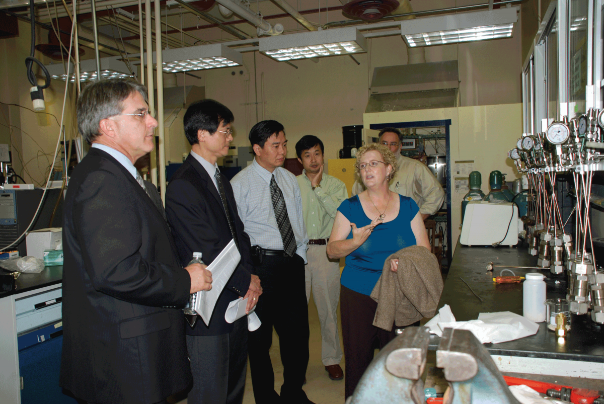 Caroline Burgess Clifford speaks to visitors from Chevron during the tour