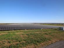 Field full of solar panels.