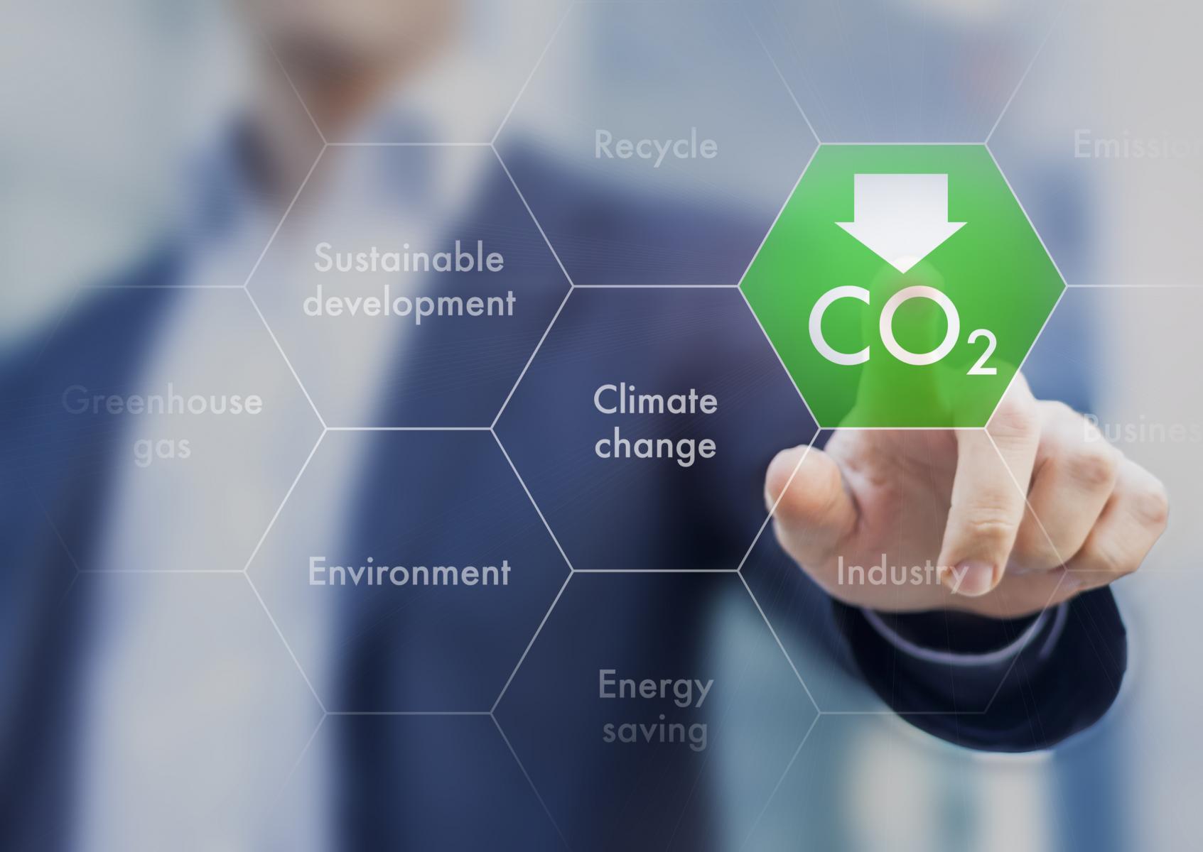 Man's finger pointing at a shape with the word CO2 inside.