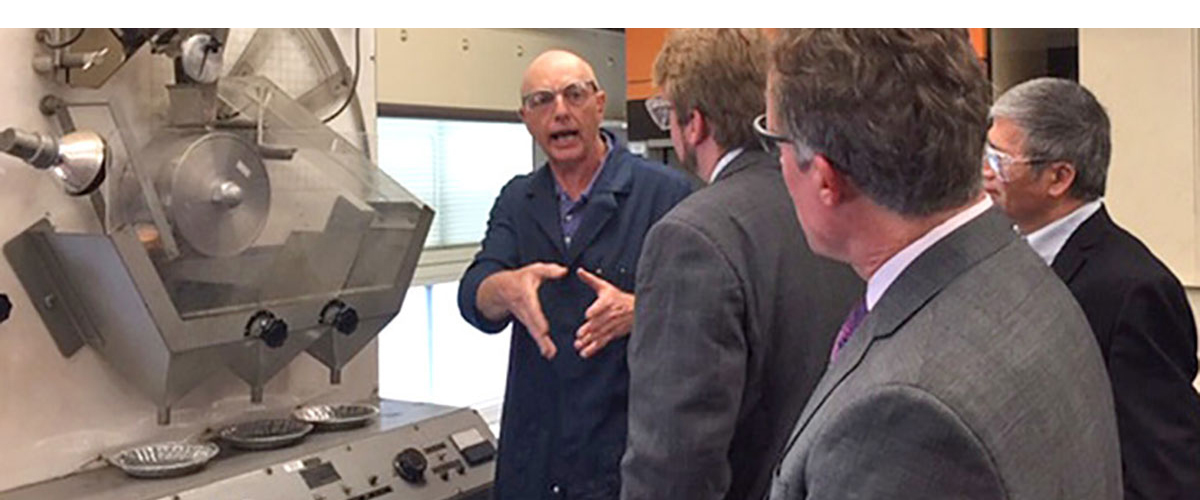 Dr. Mark Klima explains lab research to Dr. Brian Anderson, Dr. Lee Kump, and Dr. Chunshan Song.