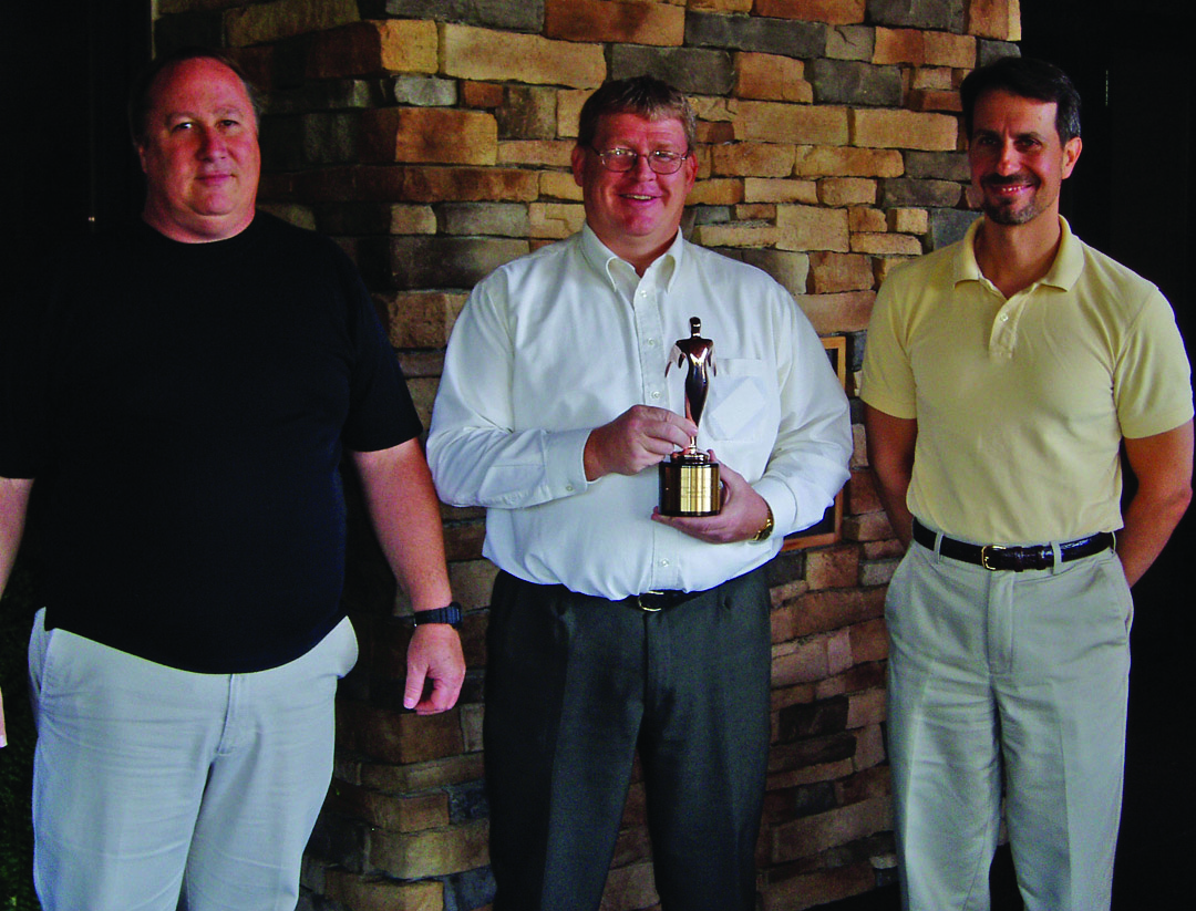 Joel Morrison, Gary Covatch and John Martin show off the bronze Telly Award
