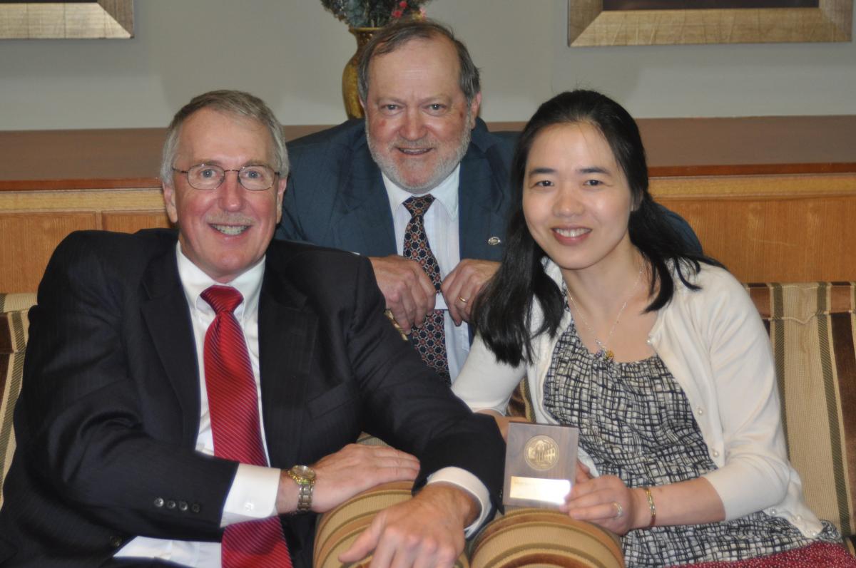 From left: Dean William E. Easterling, dean, College of Earth and Mineral Sciences (EMS); Alan Scaroni, associate dean for graduate education and research, EMS; and Li Li.