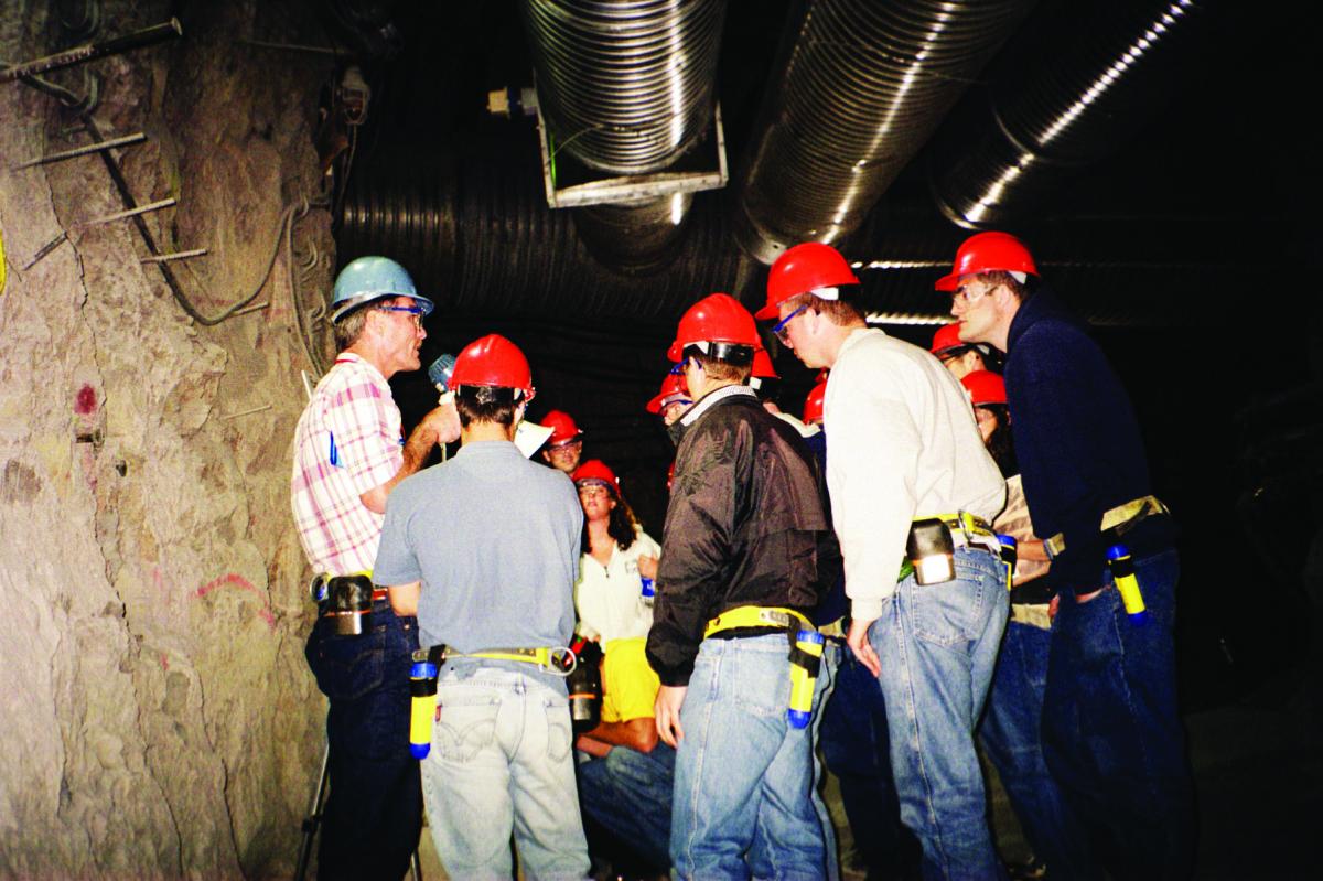Bill Boyle, Director of DOE’s Regulatory Authority Offi ce, Offi ce of Civilian Radioactive Waste Management talks to students underground at one of the many in situ experiments at the Yucca Mountain Exploratory Studies Facility, NV – the ESF is a tunnel penetrating 5 miles into Yucca Mountain.