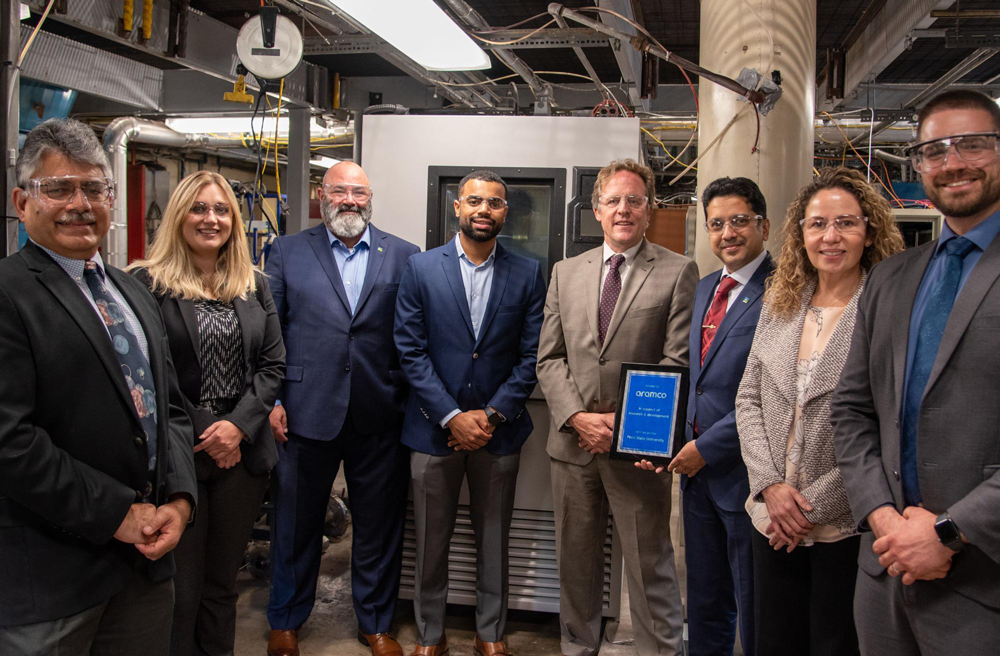 Aramco colleagues (from left to right) Sanjay Srinivasan, Emily Quick, Tim Torre, Fahad Aljabry, Lee Kump, Wajih Malibari, Zuleima Karpyn, and William Shuey stand alongside Thermotron at its new home at University Park. Credit: Penn State. All Rights Reserved.