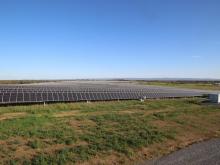 Field full of solar panels.